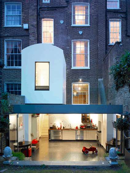 House extension maximizes kitchen area with glazed folding doors