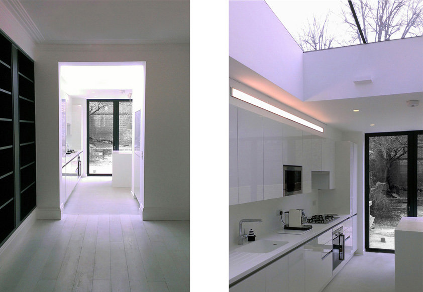 Modern white kitchen in very minimal style with glazed roof. Dean, London.