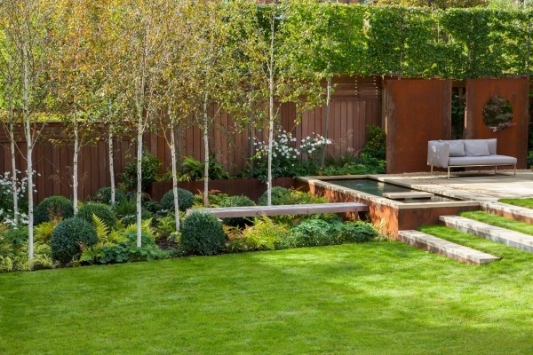 Garden design with garden pond and sofa by Sara Jane, landscape designer on Design for Me