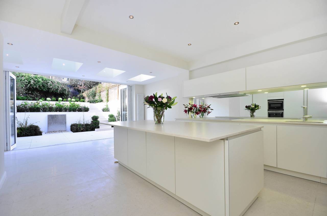 White and spacious kitchen in extension by Anna, interior designer on Design for Me