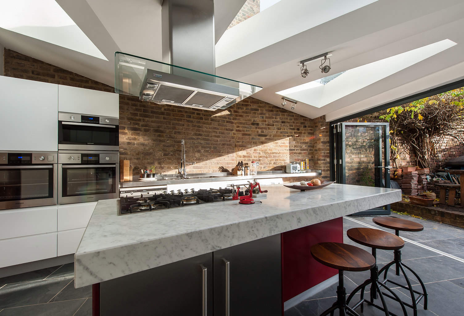 Kitchen factory design in extension with brick walls by Tom, architect on Design for Me