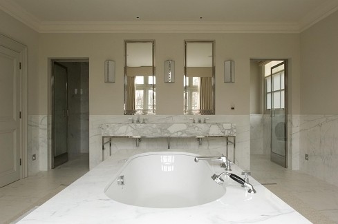 Spacious marble bathroom by Charlotte, interior designer.