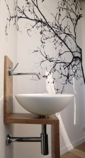 Oval sink with details on the wall by Eugenia, architectural designer